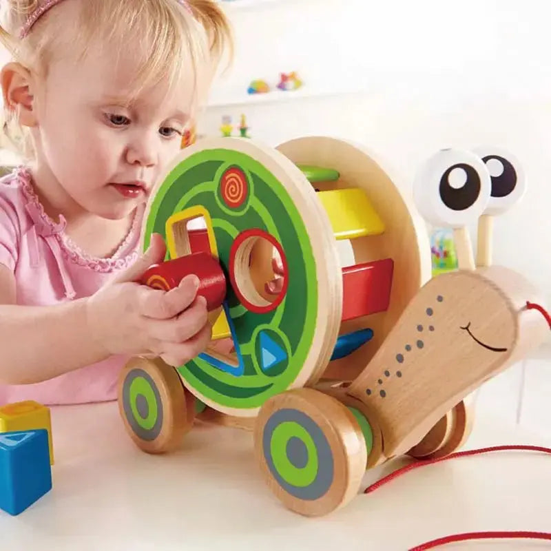 Fidtoy Juguete de arrastre con forma de caracol de madera, clasificador de formas, juguete de aprendizaje para niños pequeños