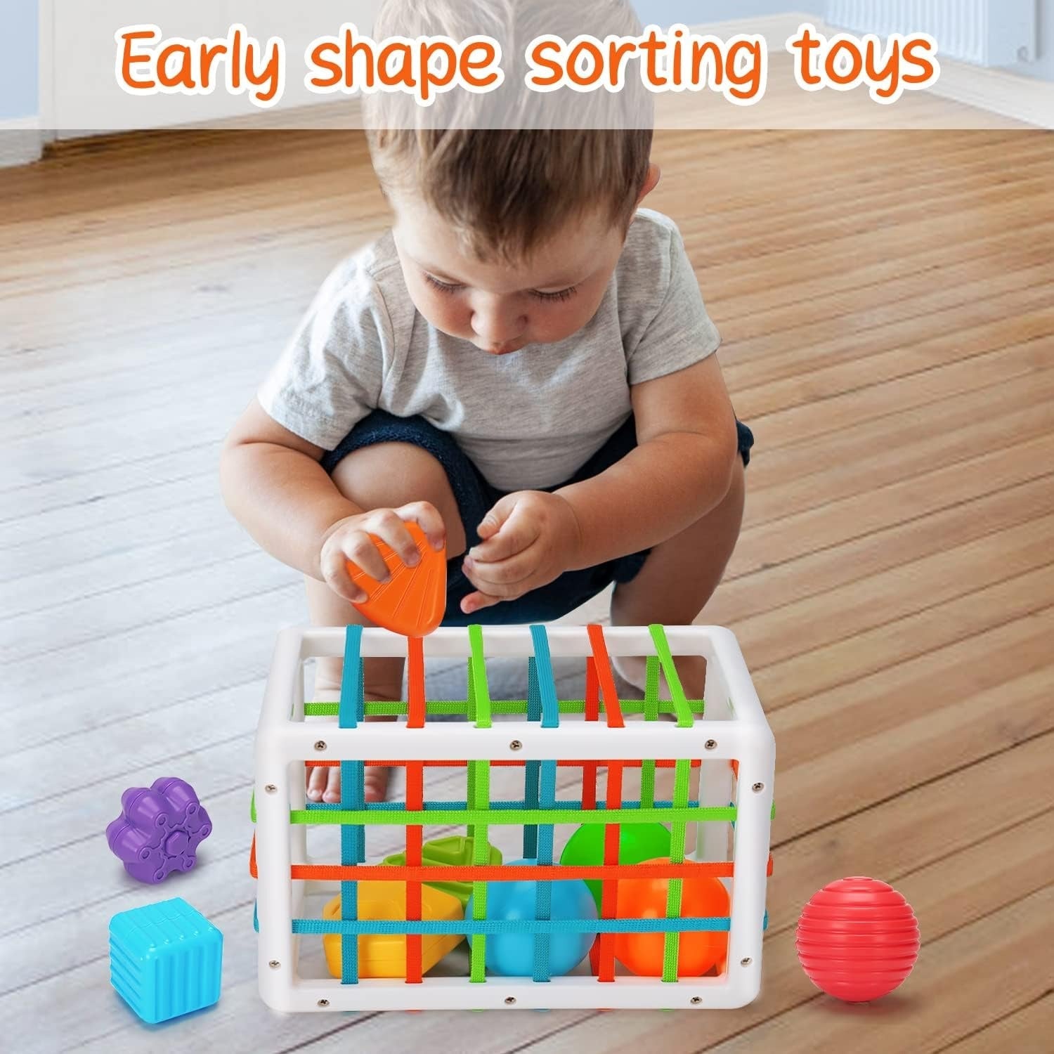 Fidtoy Shape Sorting Baby Box Sensory Play for 12+ Months, Plastic Montessori Shape Sorter Cube with 6 Textured Blocks, 3 Balls, Elastic Band Activity and Fine Motor Sensory Learning Toy
