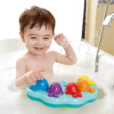 Juguete de baño con fuente de ballena musical Fidtoy para que los niños pequeños jueguen con agua